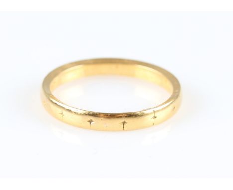 An engraved wedding band, hallmark rubbed, ring size P½.