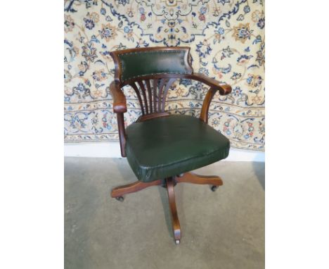 A Circa 1900's desk chair with leatherette seat and back - in clean condition 