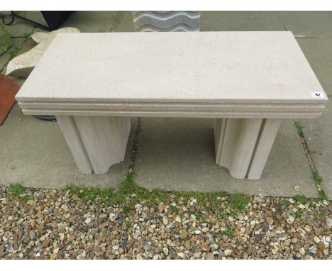 A limestone garden bench with shaped legs - 47cm H x 90cm x 40xm 