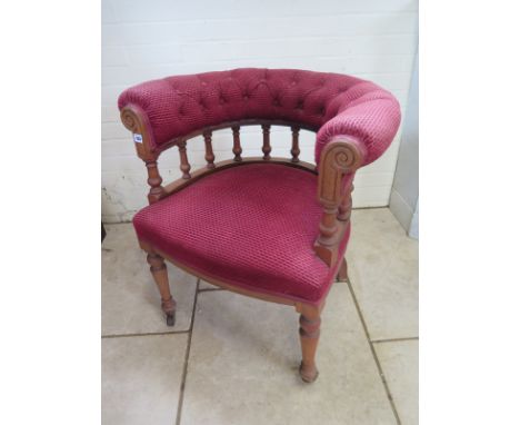 A desk chair with upholstered arm rests  and seat, turned legs with castors, condition to frame and upholstery commensurate t