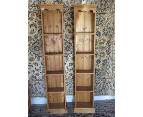 A pair of modern pine slim jim CD/Book cases - 181cm tall, 36cm wide - shelf depth 18cm 