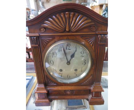 A good quality 8 day mantle clock, striking on a gong, in a burr walnut case,  37cm H x 26cm W with key and pendulum - in goo