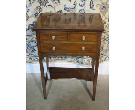 An Edwardian mahogany work table with satinwood and ebony inlays and three drawers and an under shelf, approximately 50cm wid