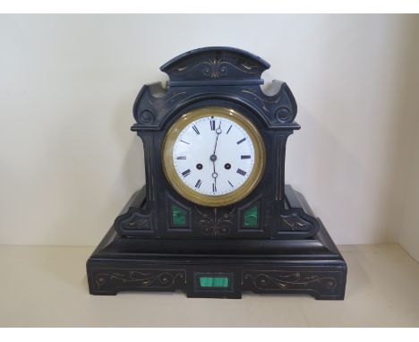 A Victorian black slate and malachite mantle clock striking on a bell, 37cm tall 40cm wide - some minor chipping, strikes, ti