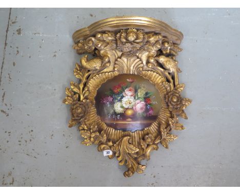 A Victorian style gilt bracket with painted cartouche - 51cm H x 45cm W 
