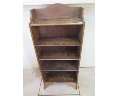 A small four shelf oak book case - 115cm tall x 51cm x 19cm 