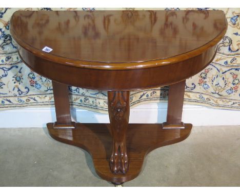 A Victorian mahogany, demi lune console table, raised upon castors, approximately 70cm high, 93cm wide, 48cm deep, in a resto