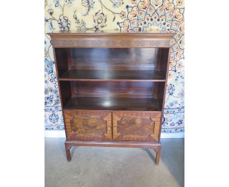 A mahogany Edwardian, oriental style, two shelf bookcase with cupboard under, 122cm height, 91cm width x 32cm depth 