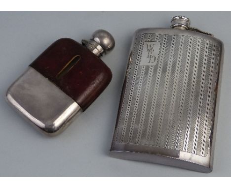 A leather covered glass spirit flask, of rounded oblong form with screw off domed hinged lid and removable base, 14cm high, t