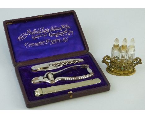 A George V 1911 Coronation commemorative smokers and drinkers set, comprising three various tools in fitted case inscribed "W