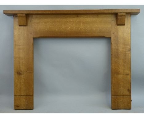 An adzed oak fire surround, by Peter "Rabbitman" Heap of Wetwang of planked construction having narrow mantelpiece on bracket