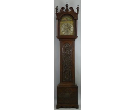 A longcase clock, the eight day movement with arched brass dial having rolling moon phase and subsidiary seconds and date dia