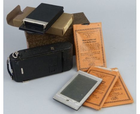 A Zeiss Icon Icarette folding plate camera, with Compur shutter, for use with 6.5cm x 9cm plates, in original box with plate 