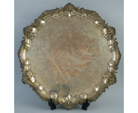 A Victorian presentation salver, of circular form chased with a ship to the centre and inscribed "To the Reverend John Robins