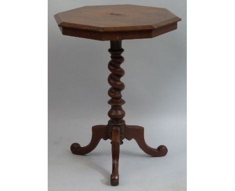 A rosewood tripod table, the octagonal top on wrythen turned stem and downswept legs with scroll feet, 53cm wide