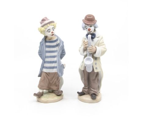 A Lladro Clown limited edition 'Little Traveller' stamped E-15 E and another&nbsp;Lladro Clown playing the Saxophone stamped 