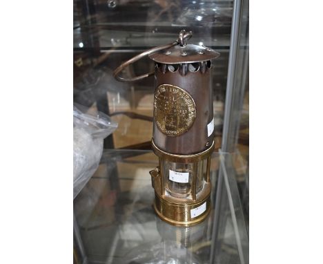 An early 20th century miners lamp, name plate type SL Prestwichs Patent.