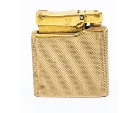 A 9ct yellow gold engine-turned ‘Calibri’ Monogas lighter with vacant cartouche, length approx 4cm x 4.5cm, total gross weigh