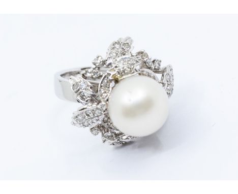 ****AUCTIONEER TO ANNOUNCE CHANGE TO DESCRIPTION****A cultured pearl and diamond white metal cluster ring comprising a round 