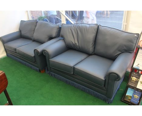 A contemporary blue leather two piece suite, comprising two seater settee and a two seater bed settee, the two seater settee 