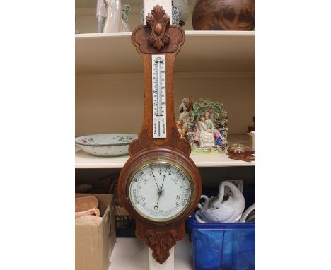 An early 20th century Aneroid Barometer and thermometer, together with a figural barometer in the form of a trout.