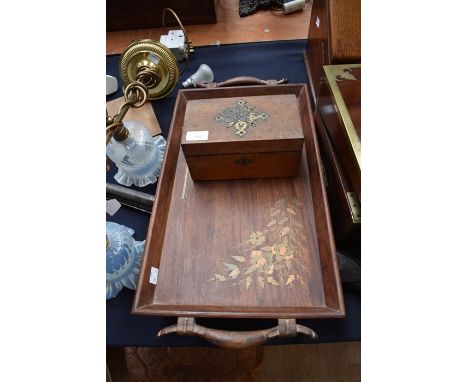 A 19th Century bird's eye maple tea caddy, the cover applied with Gothic Revival gilt metal motif, the fitted interior with r