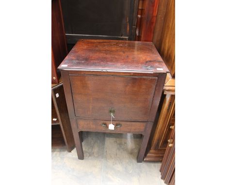A George III mahogany commode, circa 1780, missing interior, the door lifting up and sliding back, the undercarriage section 