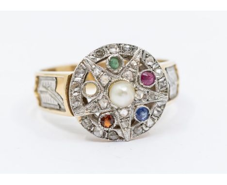 A diamond and gem set 18ct gold dress ring, comprising a circular form with an applied diamond set star to the centre within 