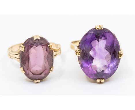 Two amethyst dress rings, comprising an oval claw set amethyst and 14ct gold ring, the stone approx. 14 x 18mm, size M, total