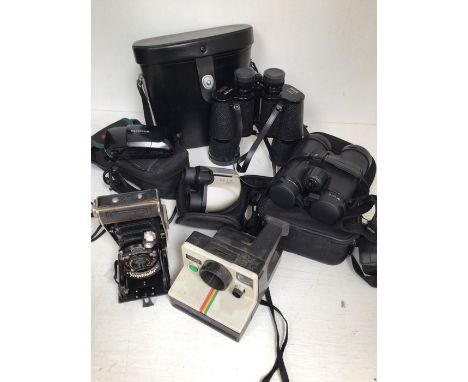 A Voightlander camera, binoculars and another camera (3)