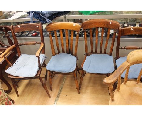 A collection of 19th Century kitchen chairs, comprising a slatted high back open armchair, a pair of smaller side chairs, or 