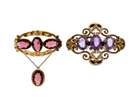 A Victorian amethyst and yellow metal brooch assessed as 9ct gold comprising three oval amethyst set to the front within open