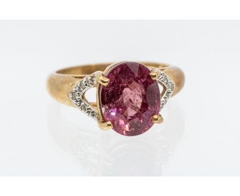 A Royal ruby and  diamond 9ct gold ring, the centre set with an oval cut ruby weighing approx 5.6carats, with spilt shoulders