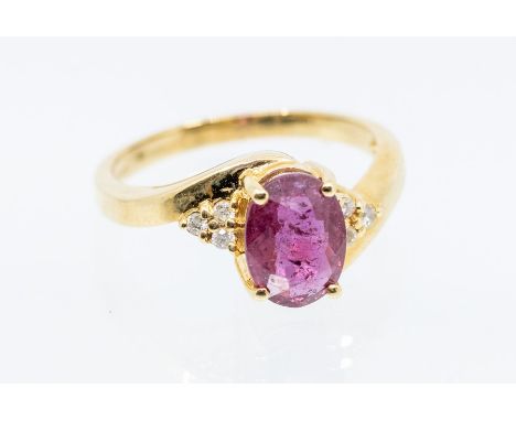 A Majestic ruby and diamond 18ct gold ring, comprising an oval cut ruby claw set to the centre, weighing approx 1.9carats, th