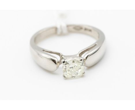A diamond and platinum solitaire ring, comprising a claw set cushion cut diamond, weight approx. 0.78ct, assessed clarity I1,