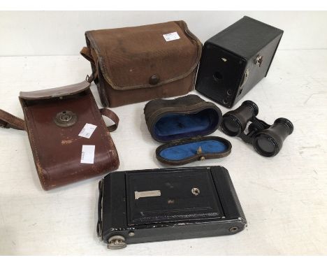 Two vintage cased cameras along with early 20th century cased theatre glasses.