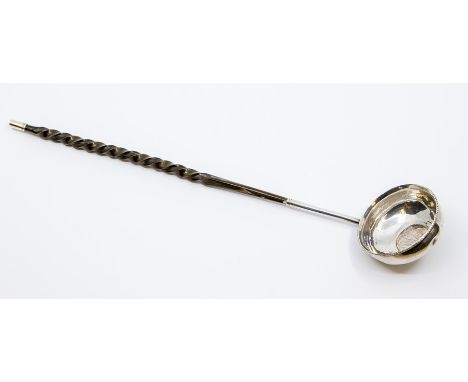 A George II ladle, white metal bowl, gadrooned rim, the centre inset with a Queen Ann shilling 1708-1711 fourth bust, the opp