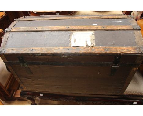 An early 20th century wooden trunk, no interior, measuring approx. 82cm x 52cm x 46cm.