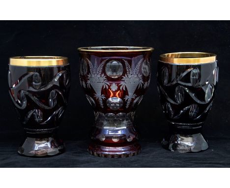 Three Bohemian 19th century ruby flash glass goblets.