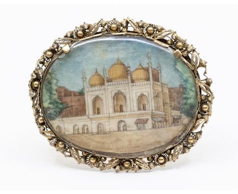 A fine large 19th century Indian gold backed brooch, oval in form with a decorative filigree and bead border, length approx. 