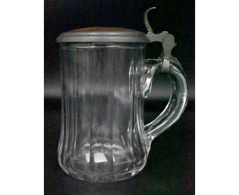 A Continental possibly German glass tankard with pewter handles and cover, the cover inset with enamel plaque painted with a 