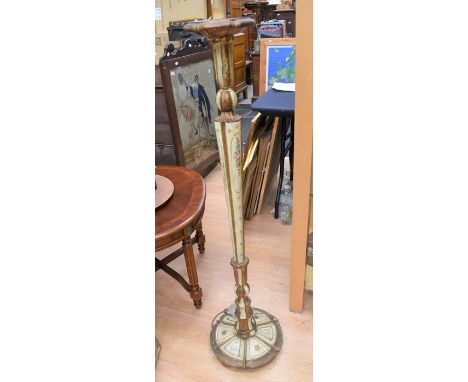 An Italianate style painted tapering standard lamp on circular base, the body gold painted with cream sections painted with f