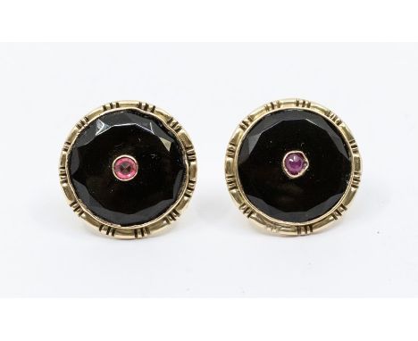 A  pair of Russian onyx and ruby 14ct gold earrings, circular form set to the centre with a ruby/paste , overlaid on onyx wit