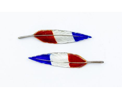 A pair of mid 20th Century silver and enamel brooches in the form of a feather with tricolour red, blue, white guilloche enam