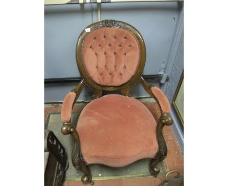 A GOOD VICTORIAN MAHOGANY OPEN ARMCHAIR with buttoned upholstery the oval surround with carved surmount scroll arms and cabri