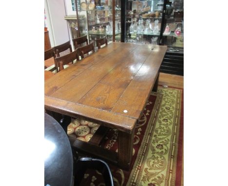 A GOOD OAK PLANKED REFECTORY TABLE on square chamfered legs and cross stretchers 103cm x 214cm