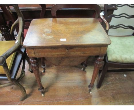 A VICTORIAN WALNUT SEWING TABLE with quarter veneered top frieze drawer and lobed turned tapering legs 72cm (h) x 61cm (w) x 