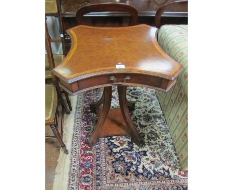 AN UNUSUAL WALNUT SHAPED TOP OCCASIONAL TABLE on four outswept legs