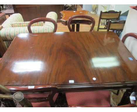 A VICTORIAN MAHOGANY DINING TABLE on lobed tapering legs 97cm x 145cm