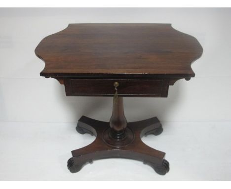 A REGENCY ROSEWOOD SHAPED TOP OCCASIONAL TABLE on platform base